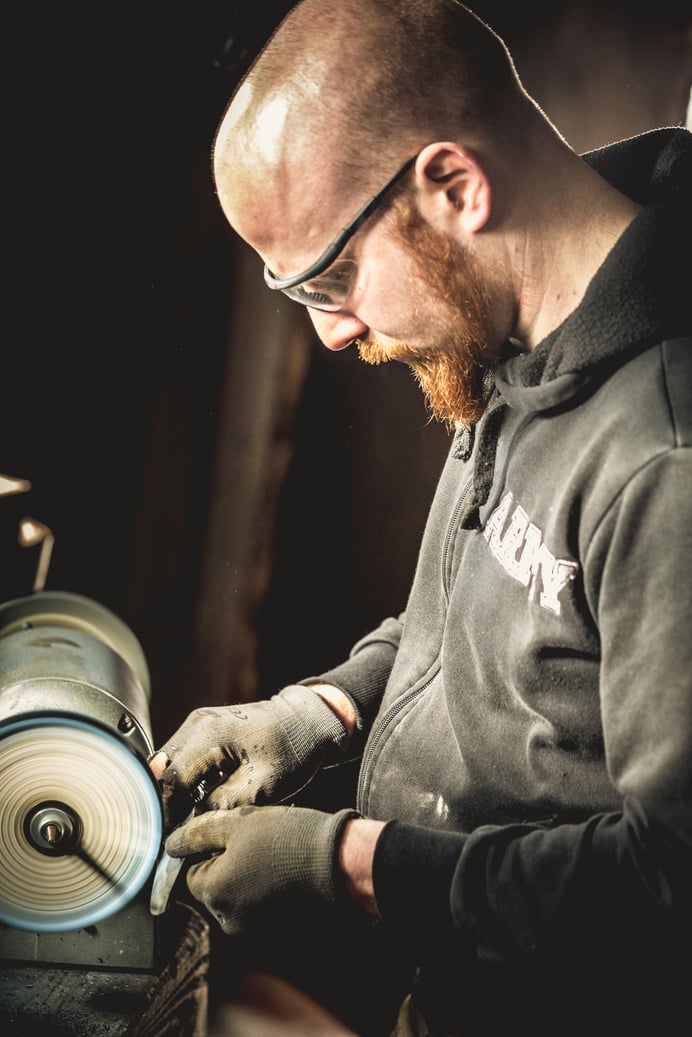 Blacksmith Sharpening and Polishing a Knife